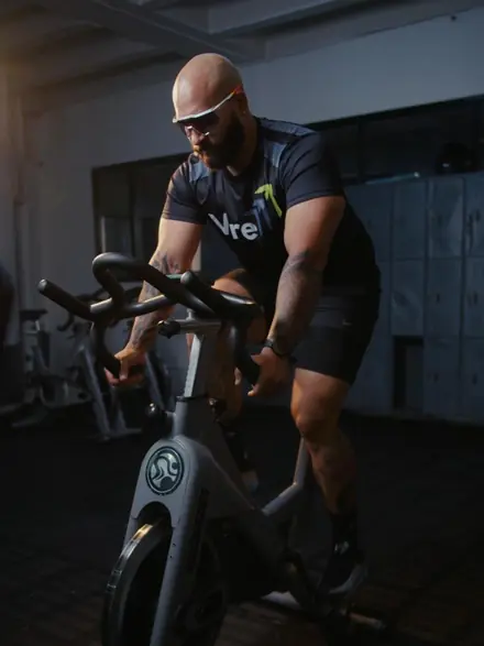 Jorge Zapata, ZapataFit, VIRE ambassador, on a stationary bike